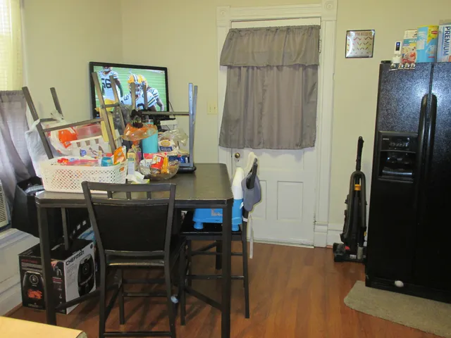 a room with furniture and a flat screen tv