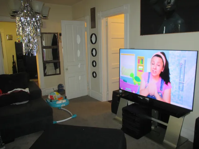 a bedroom with a bed and curtain