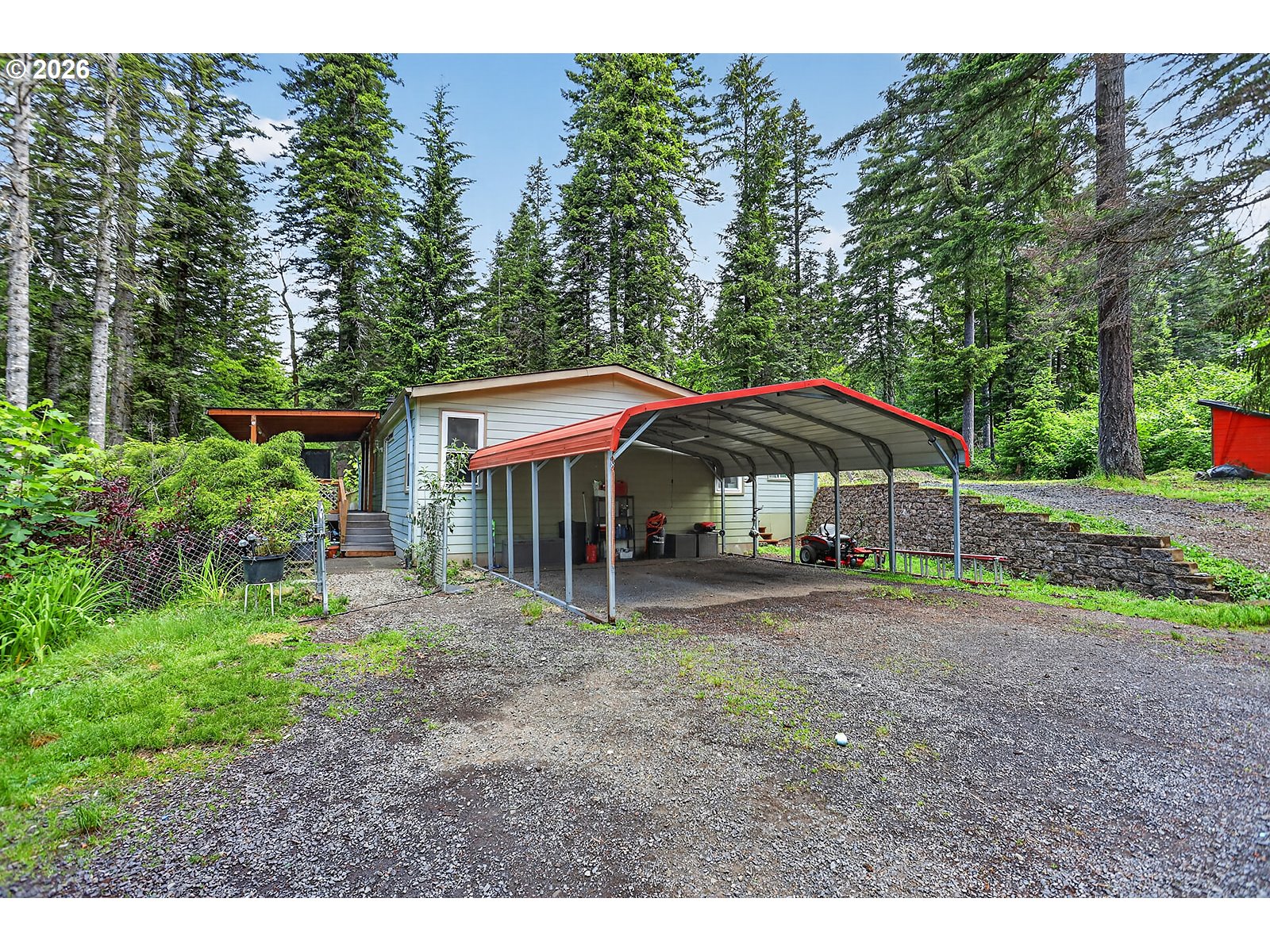 142 Spring Lane South Stevenson, WA 98648 - Photo 20 of 29 a backyard of a house with table and chairs