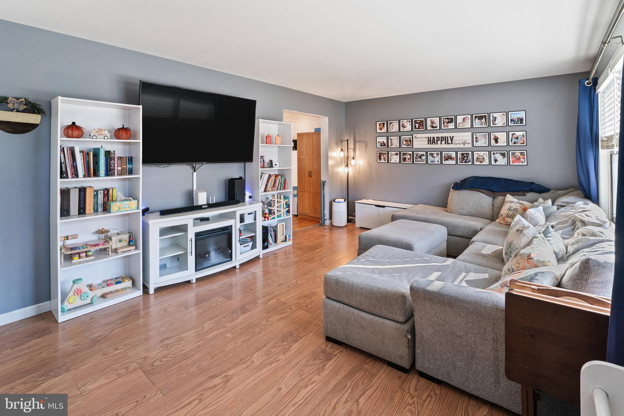 311 Tyler Avenue Carneys Point, NJ 08069 - Photo 3 of 29 a living room with furniture and a flat screen tv