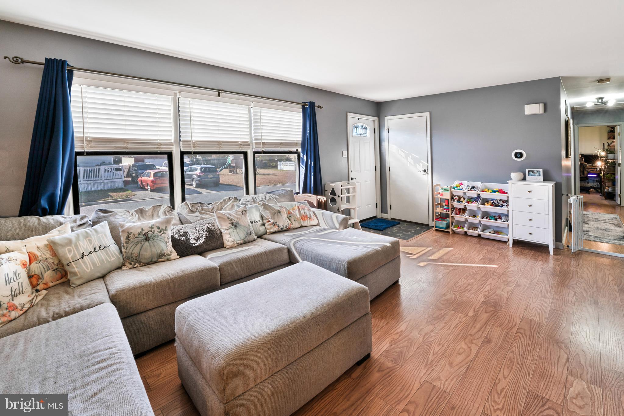 311 Tyler Avenue Carneys Point, NJ 08069 - Photo 4 of 29 a living room with furniture and large windows