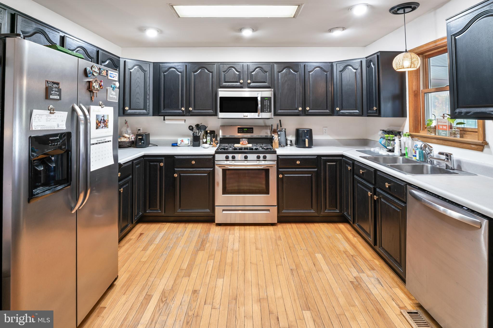 311 Tyler Avenue Carneys Point, NJ 08069 - Photo 5 of 29 a kitchen with stainless steel appliances granite countertop a stove top oven a sink dishwasher and a refrigerator