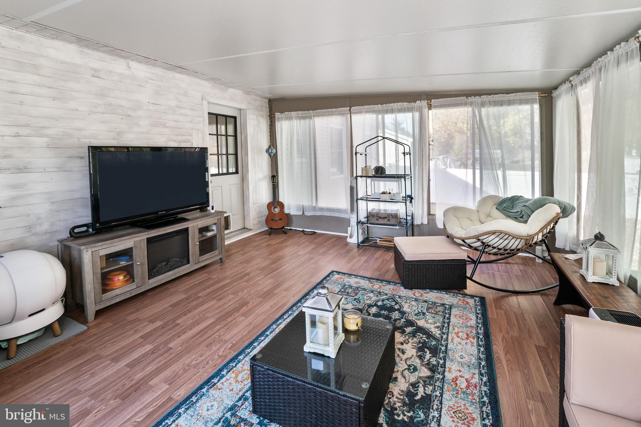 311 Tyler Avenue Carneys Point, NJ 08069 - Photo 10 of 29 a living room with furniture and a flat screen tv