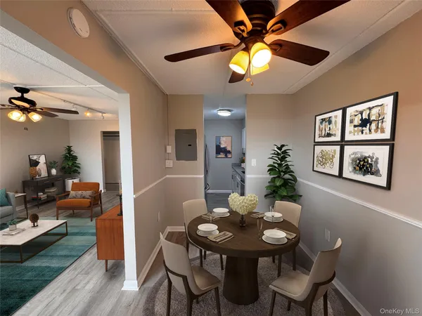 a view of a dining room with furniture and wooden floor