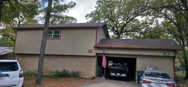 a front view of a house with garage