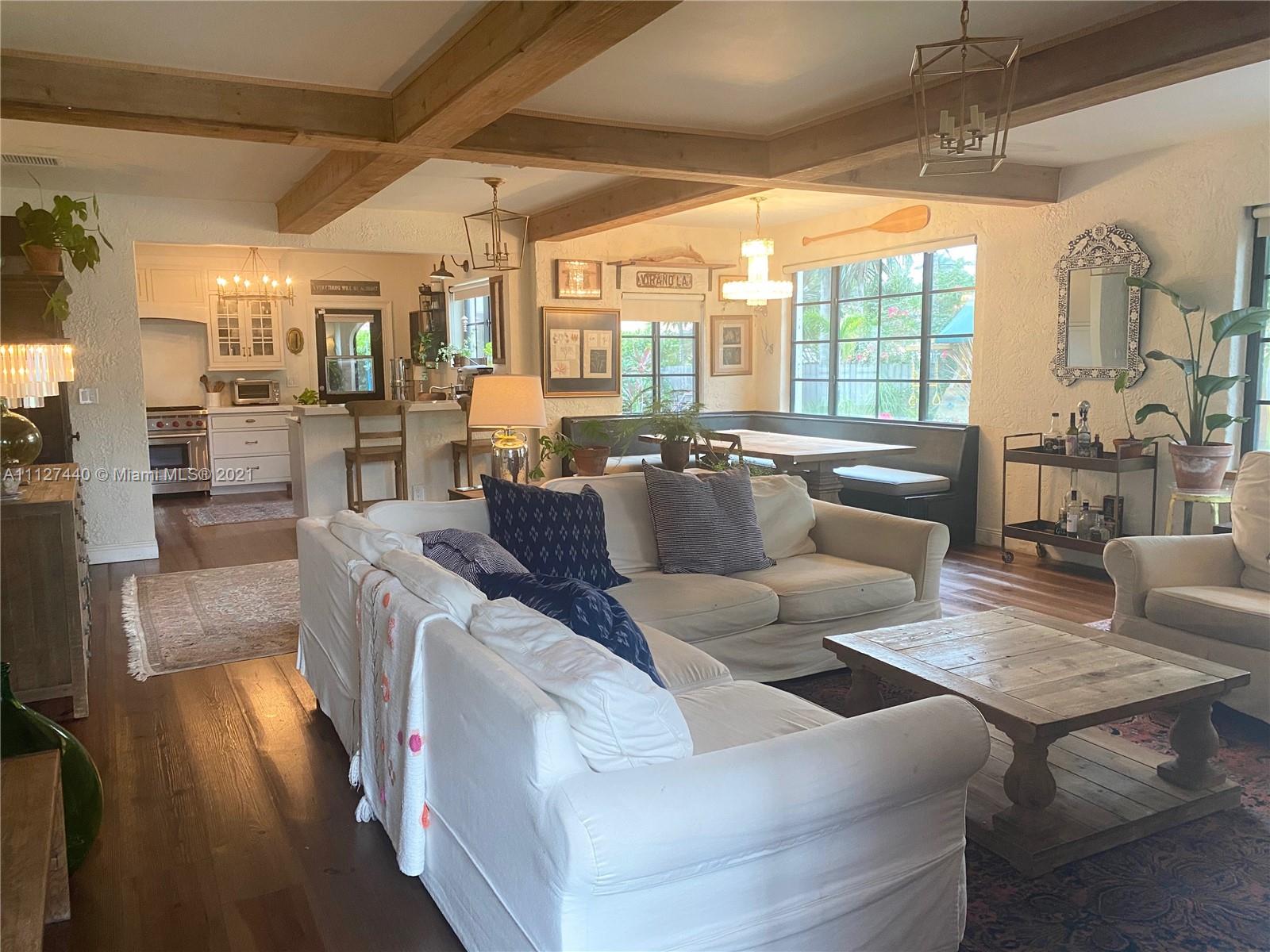 Hollywood Lakes North Lake Hollywood, FL 33019 - Photo 2 of 22 a living room with furniture and a large window