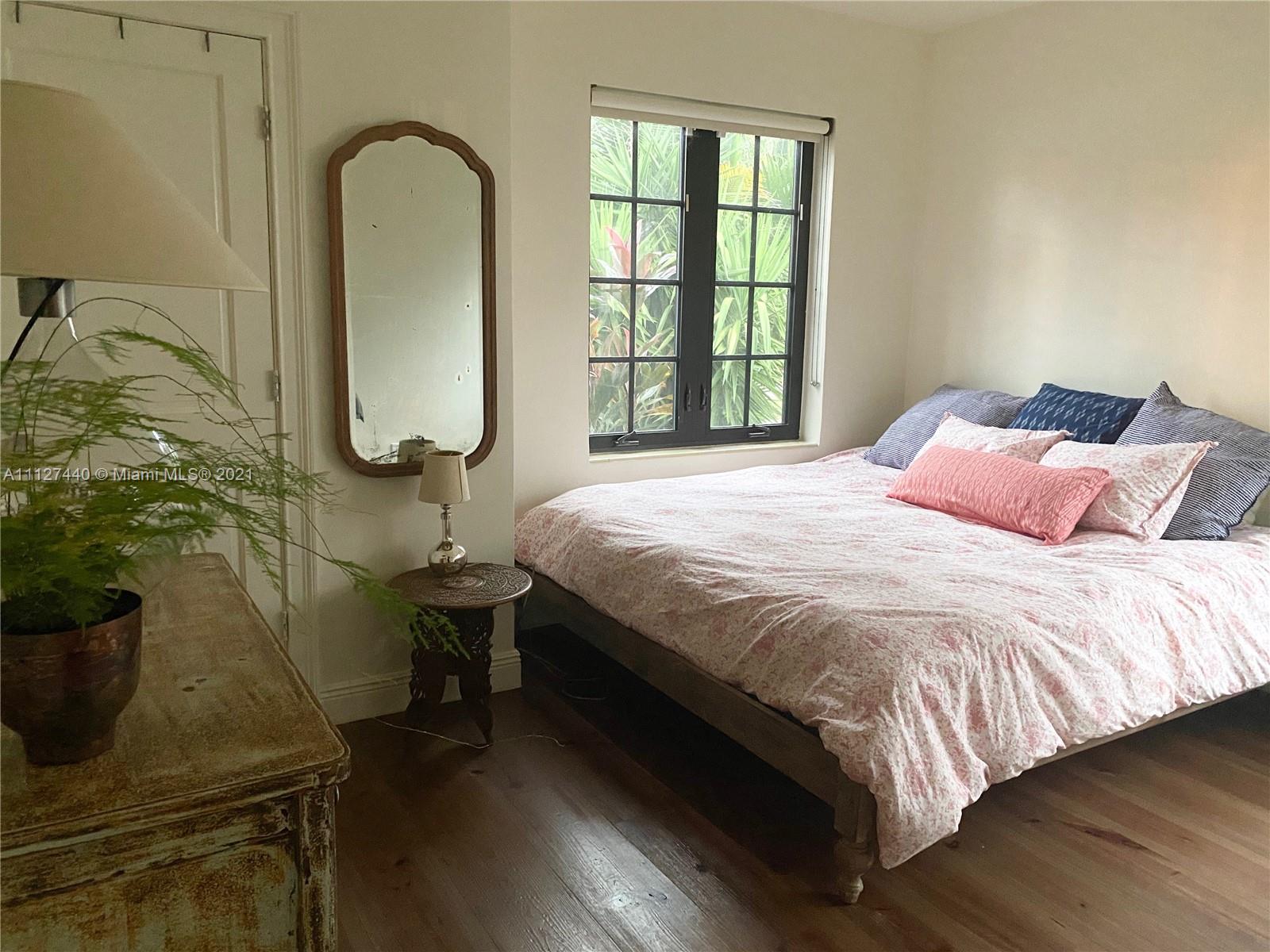 Hollywood Lakes North Lake Hollywood, FL 33019 - Photo 13 of 22 a bedroom with a bed and a window