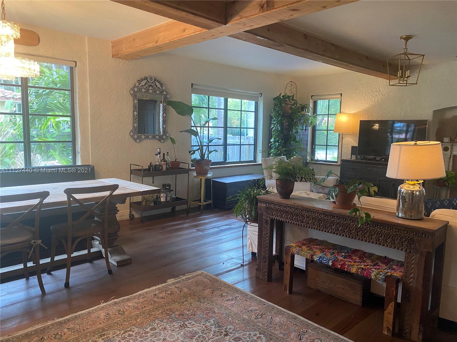 Hollywood Lakes North Lake Hollywood, FL 33019 - Photo 3 of 22 a living room with furniture a window and a table