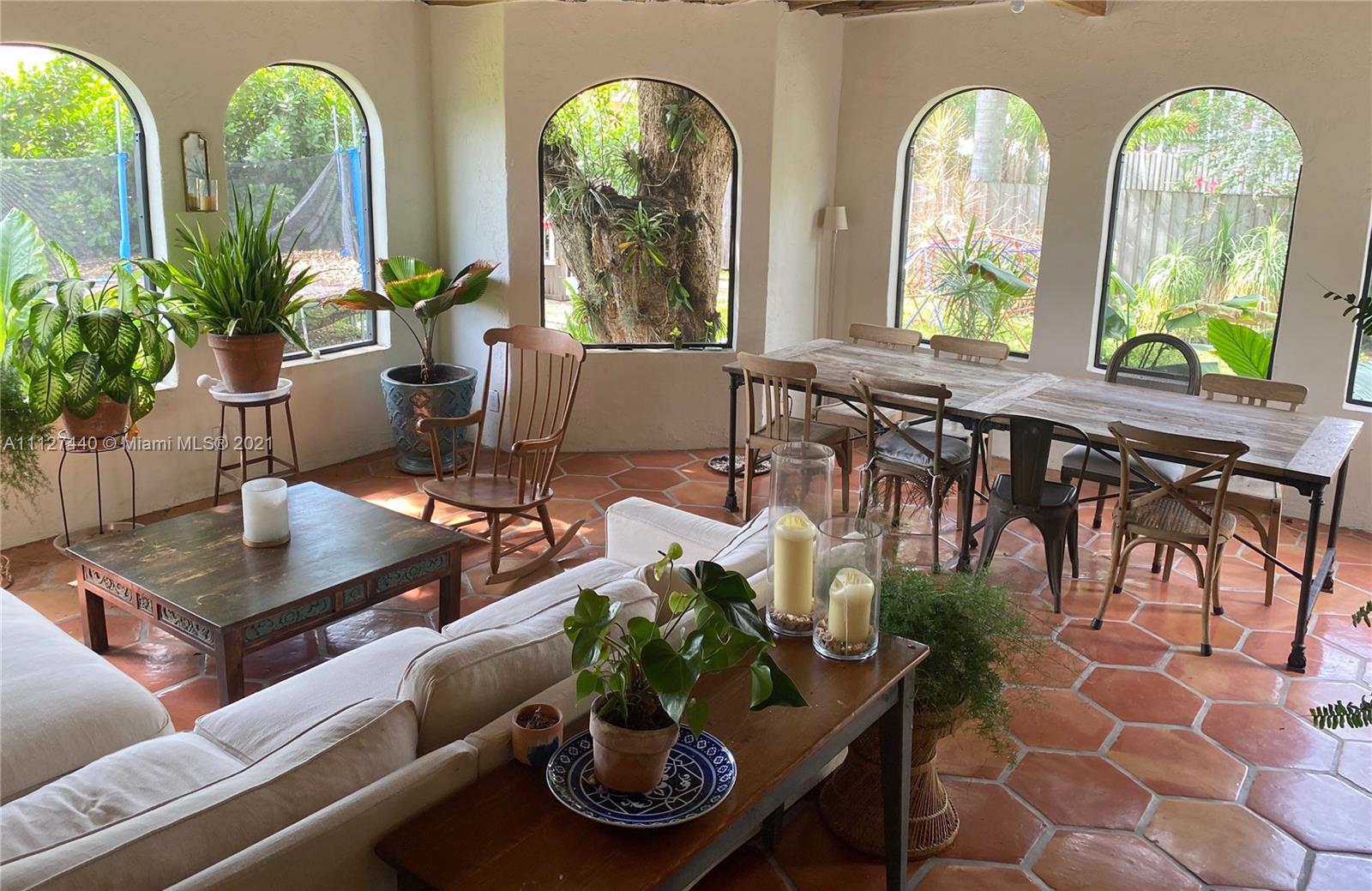 Hollywood Lakes North Lake Hollywood, FL 33019 - Photo 4 of 22 a living room with furniture potted plant and window