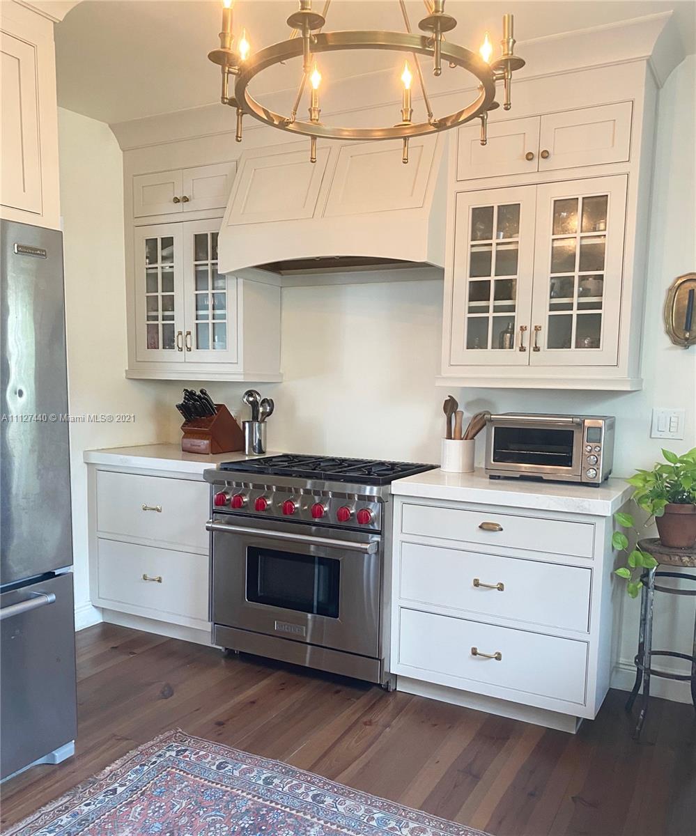 Hollywood Lakes North Lake Hollywood, FL 33019 - Photo 7 of 22 a kitchen with stainless steel appliances a stove and cabinets