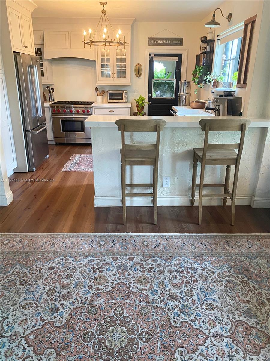 Hollywood Lakes North Lake Hollywood, FL 33019 - Photo 9 of 22 a living room with a couch and a flat screen tv