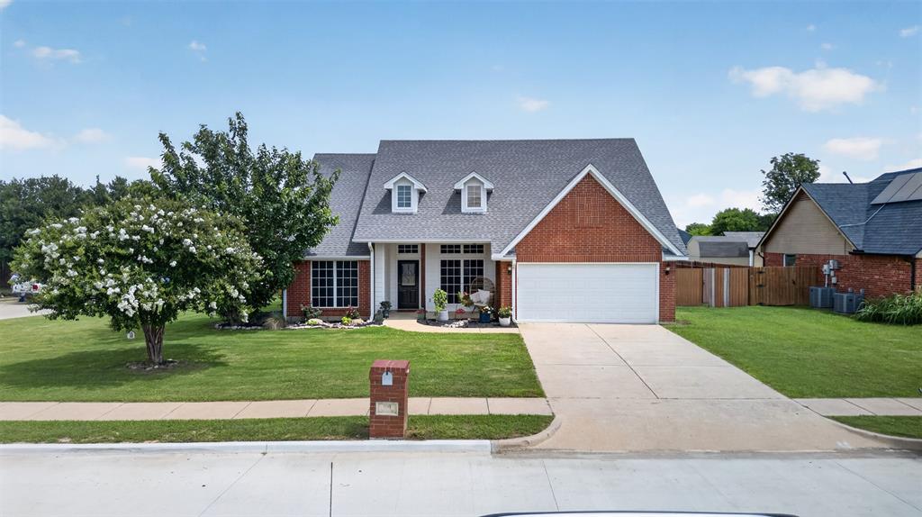 Brick facade residence with a gabled roofline
