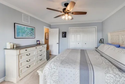 a bedroom with a bed and a dresser