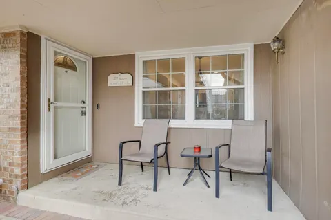 a view of a livingroom with furniture and windows