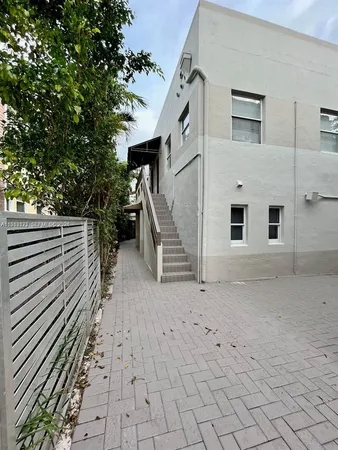 a view of a house with a barbeque