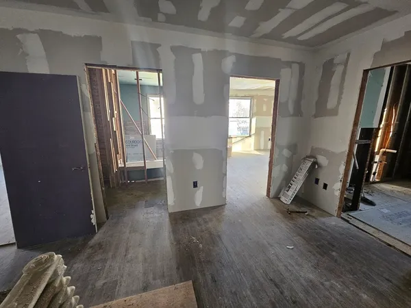 a view of entryway with wooden floor and stairs