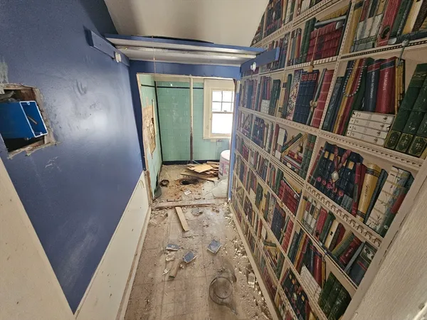 a view of an entryway with wooden floor