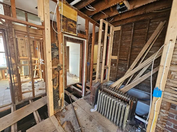 a view of a room with wooden floor