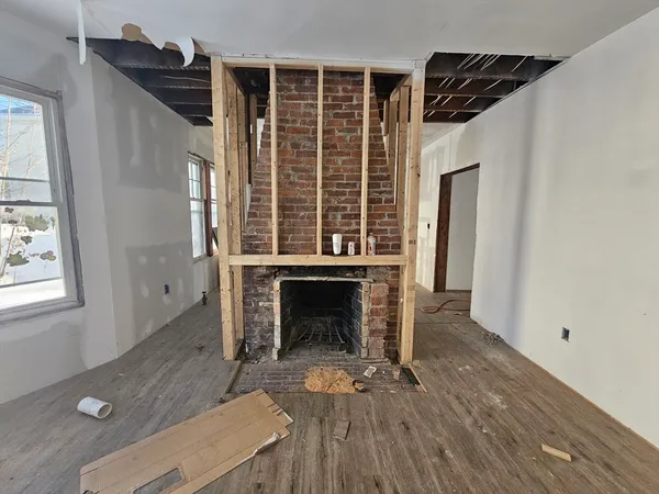 a view of a livingroom with wooden floor