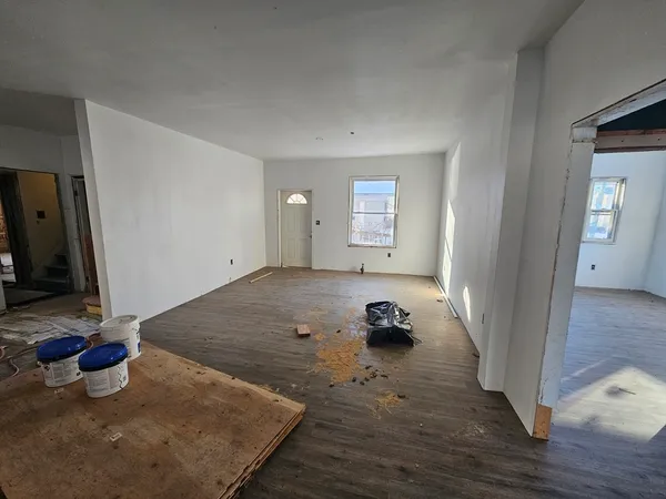 a living room with furniture window and fireplace