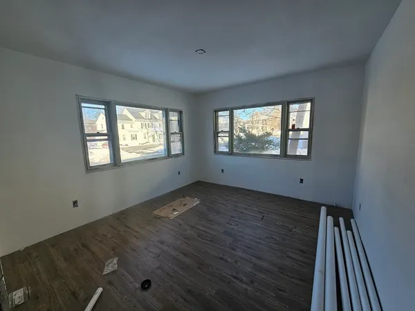 a view of walk in closet with clothes