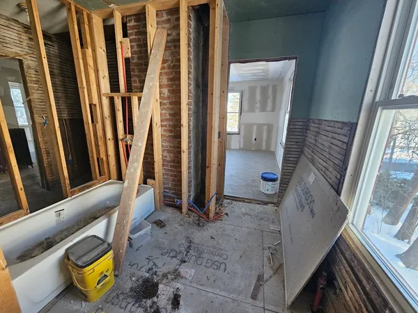 a view of an entryway with wooden floor