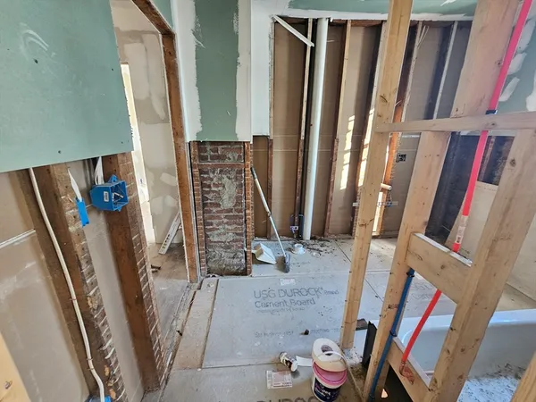 wooden floor in an empty room with a fireplace