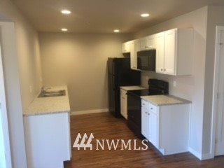 1459 East Badger Road Lynden, WA 98264 - Photo 3 of 7 a view of a storage & utility room with a washer and dryer