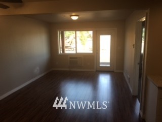 1459 East Badger Road Lynden, WA 98264 - Photo 4 of 7 a view of wooden floor and windows in a room
