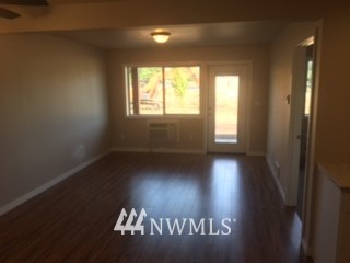 1459 East Badger Road Lynden, WA 98264 - Photo 5 of 7 a view of wooden floor and windows in a room