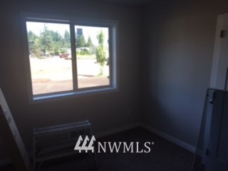 1459 East Badger Road Lynden, WA 98264 - Photo 6 of 7 a black and white wall with a window