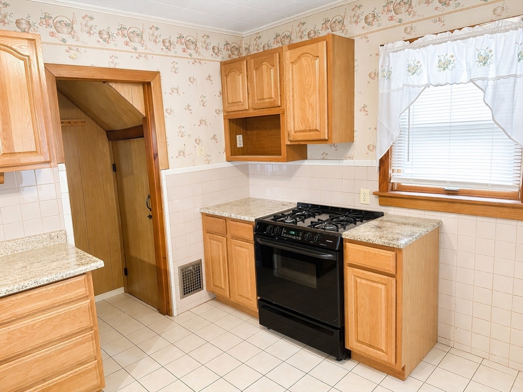 23 York Street West Springfield, MA 01089 - Photo 5 of 7 a kitchen with a stove and a refrigerator