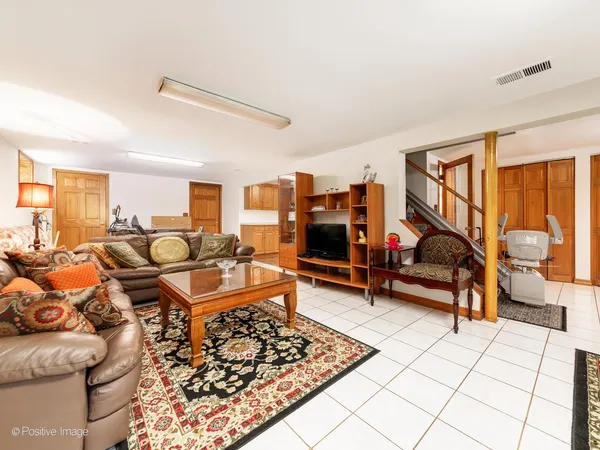 a living room with lots of furniture and a rug