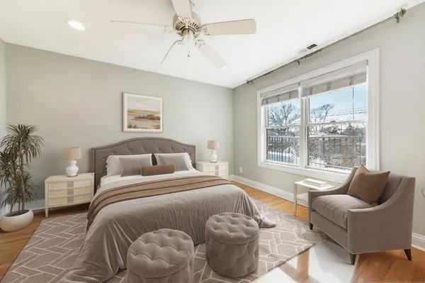 a bedroom with a bed and a couch