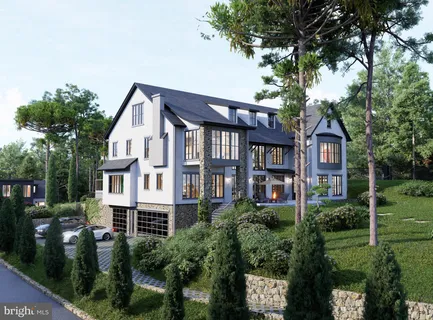 a aerial view of a residential apartment building with a yard and potted plants