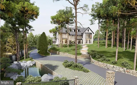 a front view of a house with a yard and potted plants