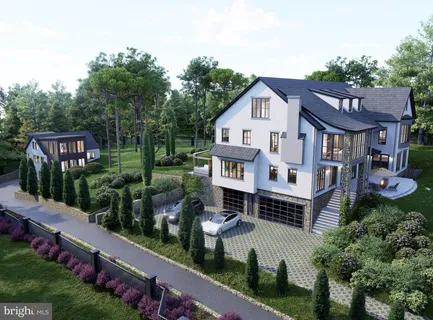 an aerial view of a house with a yard table and chairs