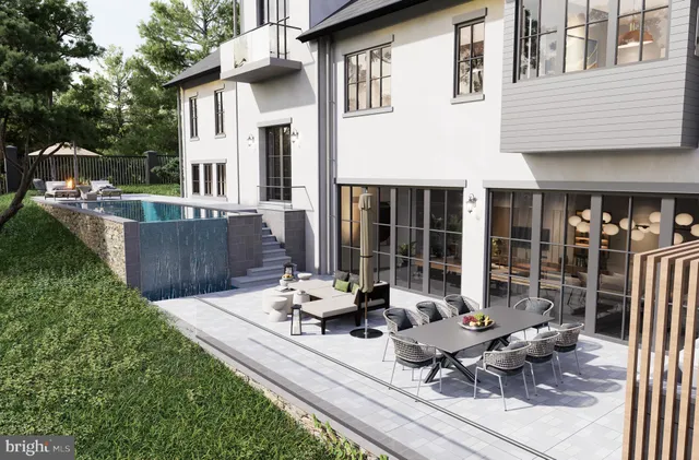 a view of a house with sitting area and garden