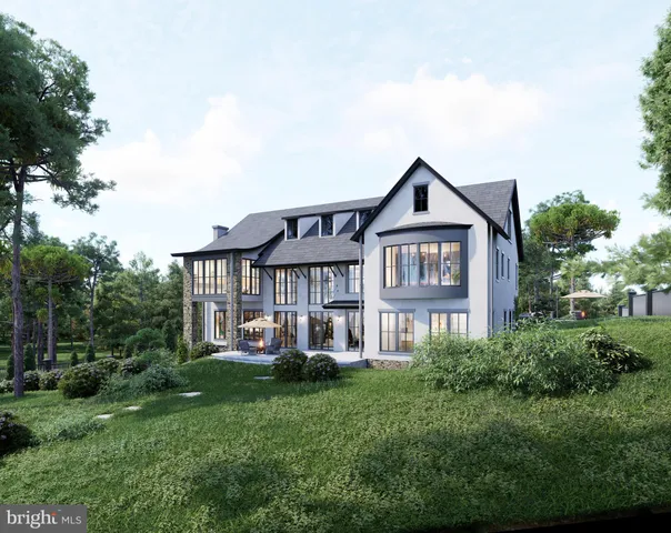 a front view of a house with a yard and trees