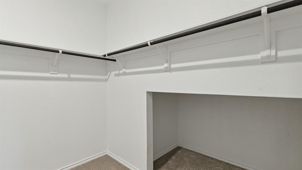 126 Pheasant Run Road Terrell, TX 75160 - Photo 20 of 26 Walk in closet with dark carpet