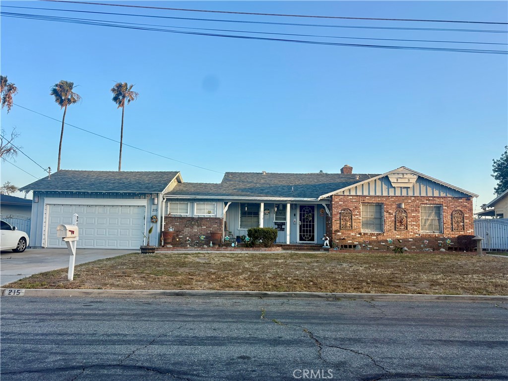 215 East Valencia Street Rialto, CA 92376 - Photo 1 of 1 a view of a house with a yard
