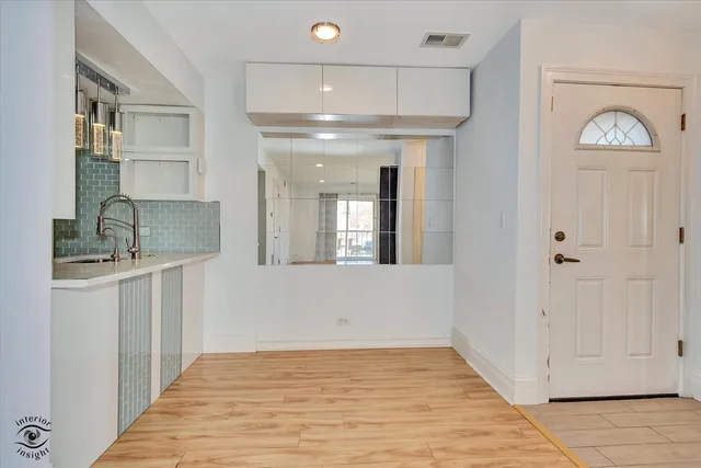 a view of entryway with kitchen
