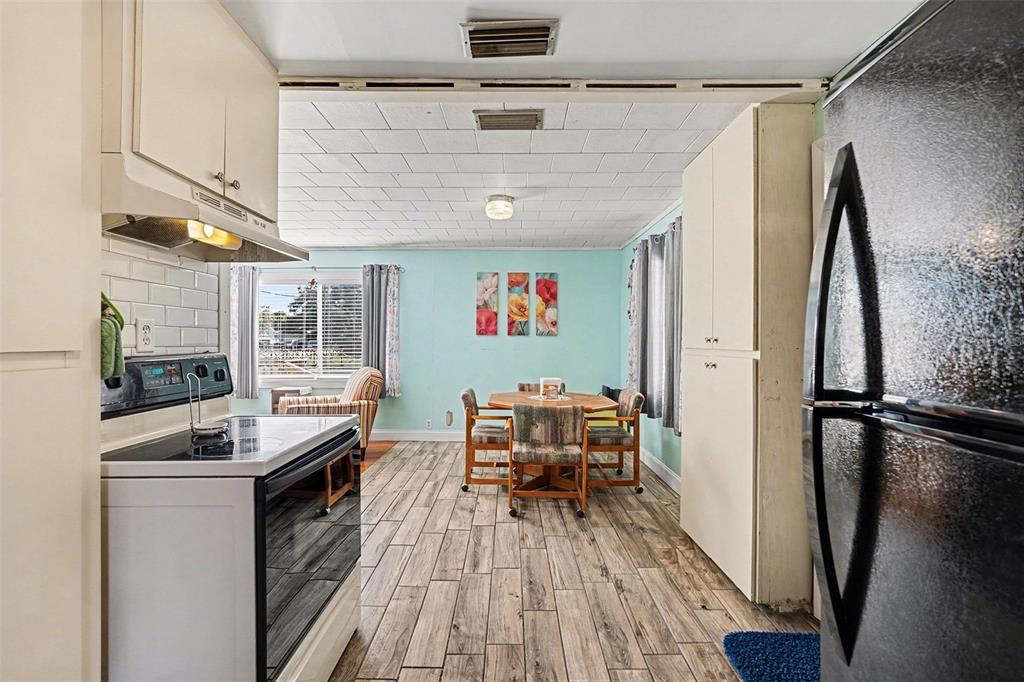 2102 Columbus Drive Brandon, FL 33510 - Photo 13 of 28 a room with furniture and wooden floor