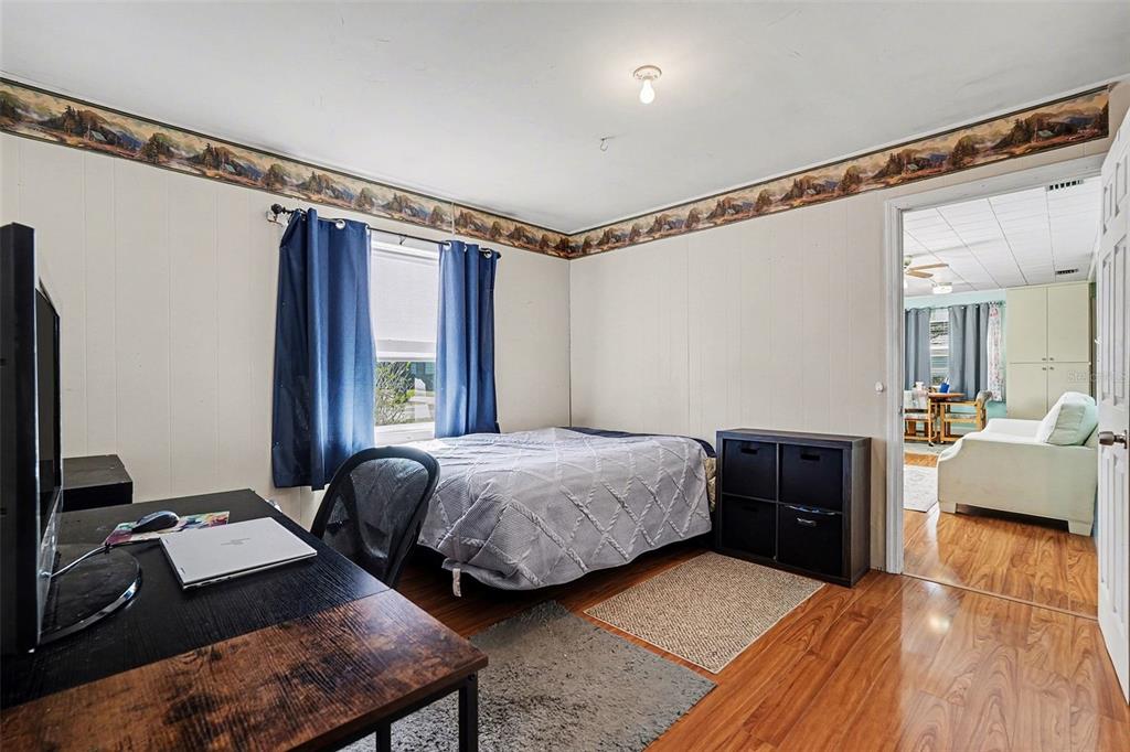 2102 Columbus Drive Brandon, FL 33510 - Photo 18 of 28 a bedroom with a bed couch and a window