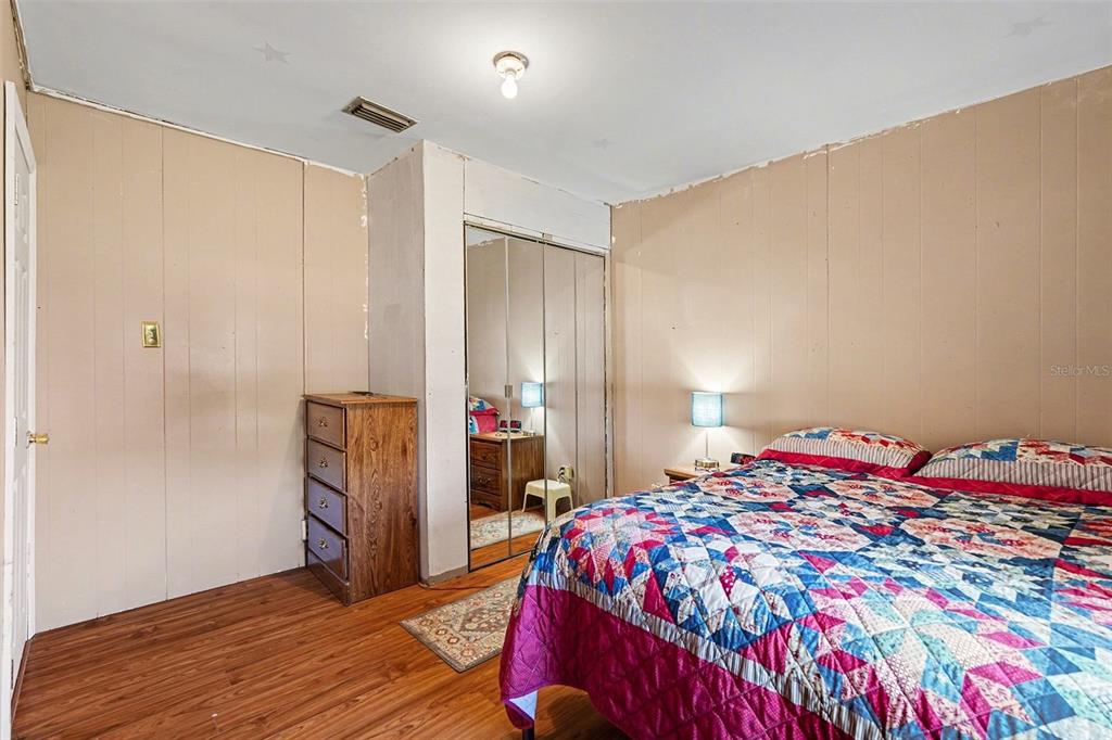 2102 Columbus Drive Brandon, FL 33510 - Photo 21 of 28 a bedroom with a bed and a closet