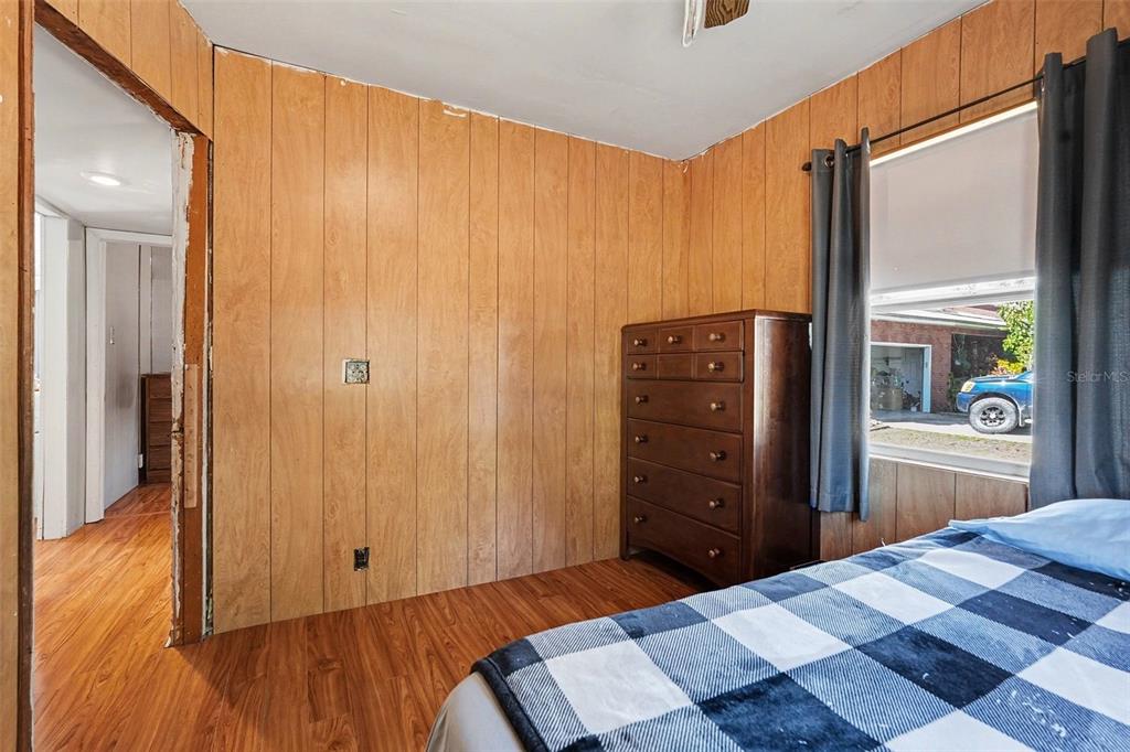 2102 Columbus Drive Brandon, FL 33510 - Photo 22 of 28 a bedroom with a bed and a dresser