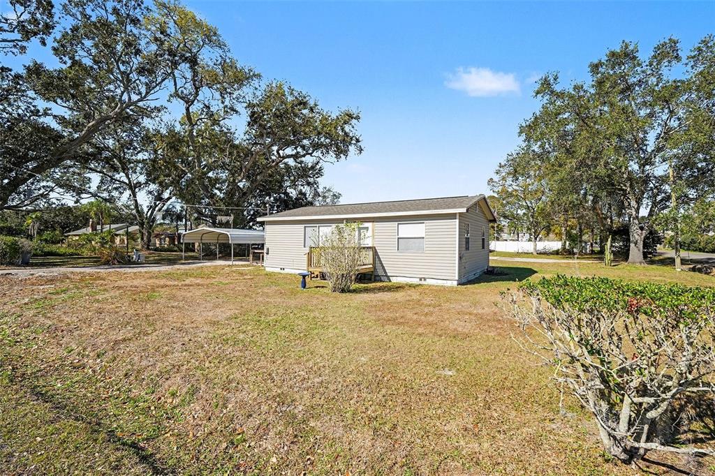 2102 Columbus Drive Brandon, FL 33510 - Photo 5 of 28 a view of a house with yard and garage