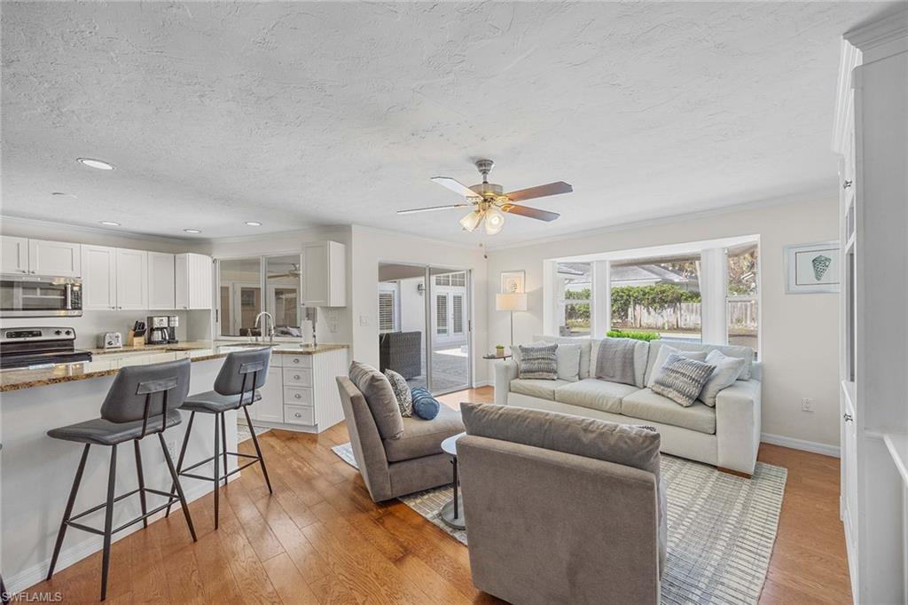 707 Portside Drive Naples, FL 34103 - Photo 13 of 35 a living room with furniture and a large window