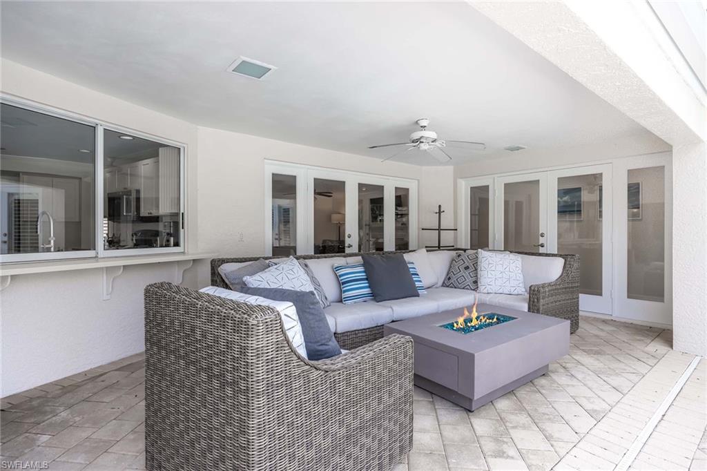 707 Portside Drive Naples, FL 34103 - Photo 17 of 35 a living room with furniture and a large window