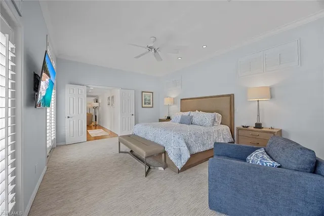 a spacious bedroom with a bed and a couch